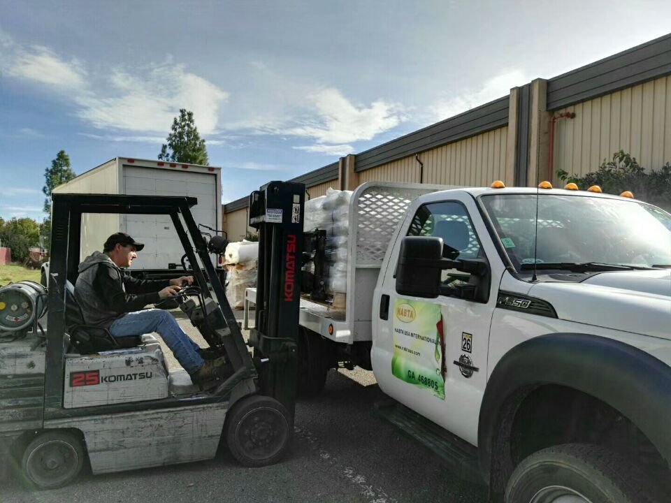 NABTA USA Logistics — Forklift loading fertilizer at California distribution facility